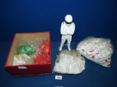 A tin of Beta Builder bricks in white, red and green and a Stig figure, 11'' tall.