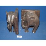 A pair of wooden Bookends in the form of Elephants.