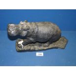 A large hand carved Ironwood Hippopotamus, 30 x 18 cms , weighs 22 kg approx. (rear leg repaired).