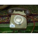 A vintage grey telephone
