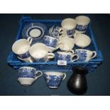 A quantity of Churchill blue & white Willow pattern cups & saucers plus a Prinknash vase.