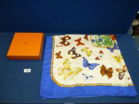 A Cathy Latham 1985 boxed Hermes silk scarf with butterfly pattern, 34'' x 34''.