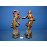 A pair of Spelter ladies on plinths, titled 'Premieres Roses', both 17'' tall.