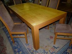 A heavy specially commissioned light Pippy Oak rectangular Dining Table standing on square legs,