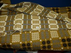 A double Welsh wool Blanket in mustard, black and white colourway.