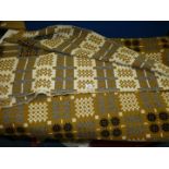 A double Welsh wool Blanket in mustard, black and white colourway.