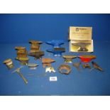 A quantity of small brass anvils and stands including a boxed Foseco Golden Jubilee commemorative