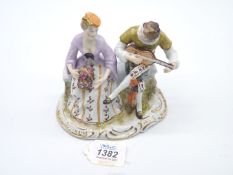 A Dresden style continental figurine (tip of instrument damaged), 5 1/4'' high.
