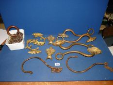 A quantity of ornate Regency style curtain brackets and tie backs and a quantity of curtain rings