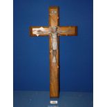 A hand carved wooden Crucifix with metal figure of Christ, 19'' long.
