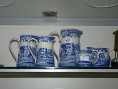 A trio of Italian Spode design jugs, 8 1/4", 6 3/4" and 5 3/4" plus two matching milk/cream jugs,
