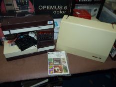 A Pfaff embroidery sewing machine and instruction book.