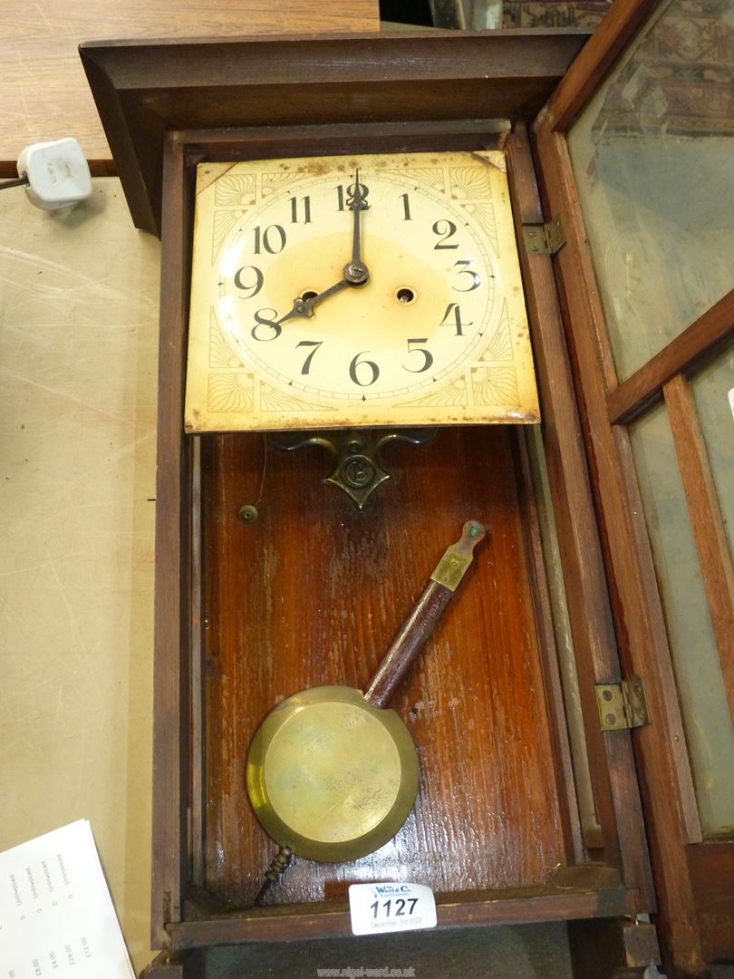 A wooden cased wall clock with pendulum. - Image 2 of 2