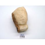 An early fragmentary alabaster head of a woman wearing a headdress of Renaissance style;