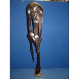 A Mekondie Tribe ebony sculpture from Tanzania, 35" high.