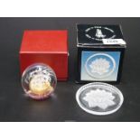 A Royal Crest 'Nimbus' paperweight plus a boxed set of six glass coasters.