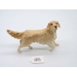 A Royal Doulton Retriever, gloss finish, boxed, 7'' long x 5'' tall.