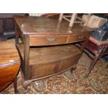 A circa 1930's Mahogany bow fronted Buffet/Dumb Waiter having a pair of upper frieze drawers and a