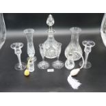 A cut glass Decanter, water jug, two pairs of Stuart crystal candle holders and two atomisers.