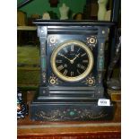 A French black marble Mantle Clock with malachite inlay,