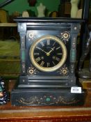 A French black marble Mantle Clock with malachite inlay,