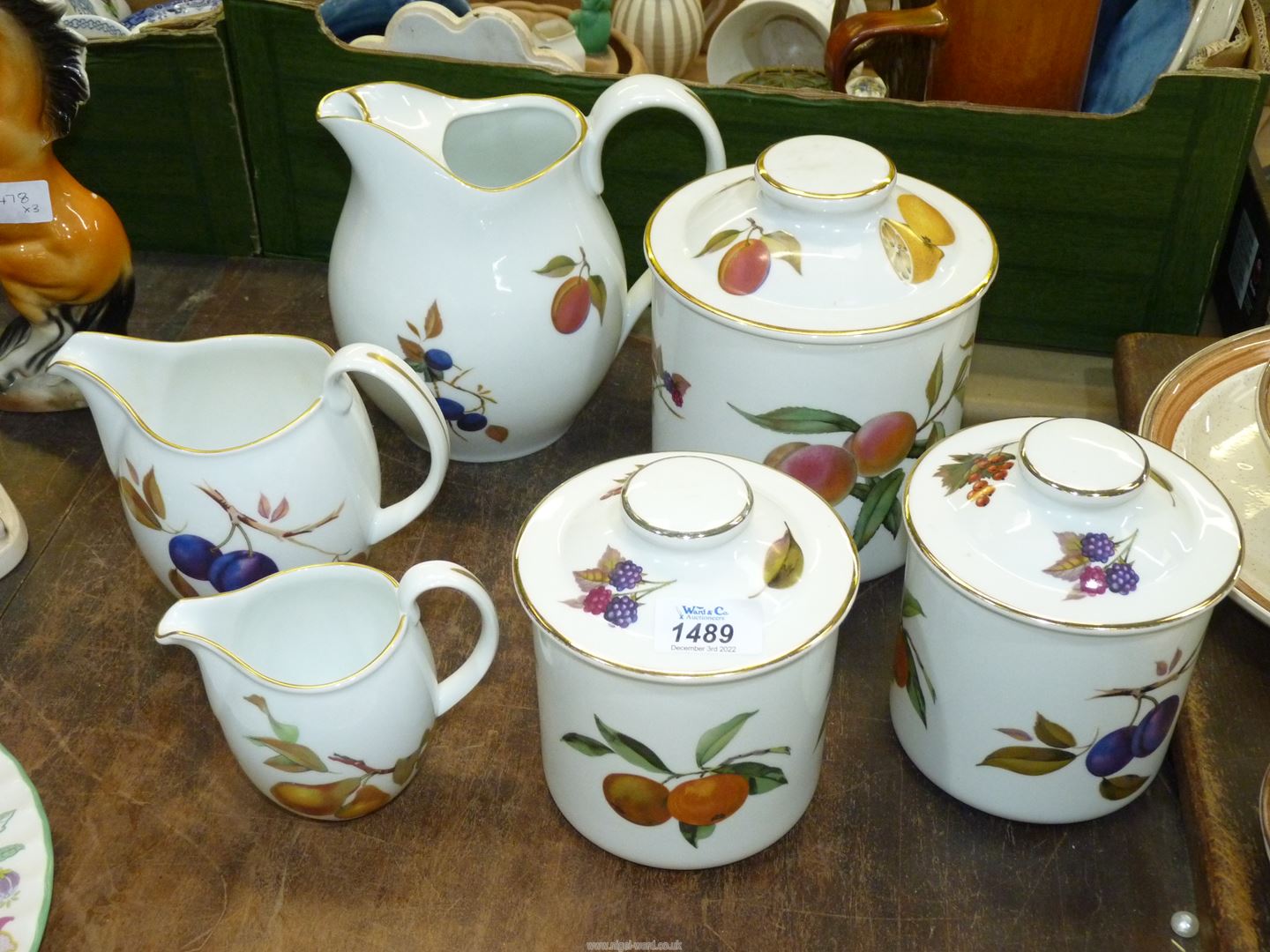 Six pieces of Royal Worcester 'Evesham' china including three storage jars,