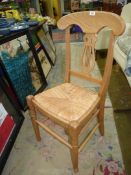 A contemporary lightwood framed lyre backed sea-grass seated Side Chair having turned front legs.