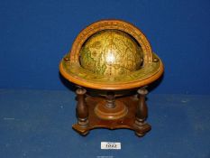 A small Globe on stand with depictions of astrological signs, 10'' tall x 8'' diameter.