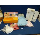 A Sindy bed, wardrobe and bath (in original box), and some Sindy clothes.