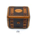 A highly unusual Victorian Walnut tea Caddy formed to represent a traveller's steam trunk,