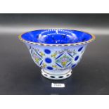A pretty Bohemian blue glass Bowl painted with white flowers having a gilt rim,