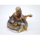 A large Capo de Monte figure 'Arabian Merchant' 9 1/2'' x 9'' x 10'' tall.