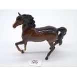 A Beswick Bay Arab Horse, gloss finish, boxed, 7 1/2'' long x 7'' tall.
