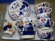 A small quantity of Gaudy Welsh china to include; 2 milk jugs and 5 cups & saucers.