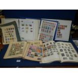 A quantity of old Stamp books including Ambassador World Stamp album, Stanley Gibbons, etc.