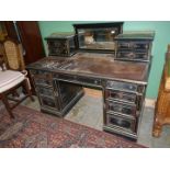 A good "Gillow & Co" double pedestal desk having ebonised finish with gilded detailing,