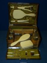 A ladies Crocodile skin Vanity Case with silver topped glass bottles, hallmarks for London 1899,