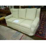 An elegant winged three seater Settee,