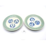 A pair of interesting and unusual porcelain dishes glazed in green celadon,