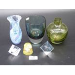 Three coloured glass vases and paperweights including bird, hedgehog etc.