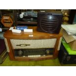 A vintage Nekermann Tohnmeister radio, a Rees Mace Bakelite speaker and a small box of valves.