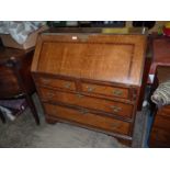 An attractive Oak Bureau, cross-banded with Mahogany,