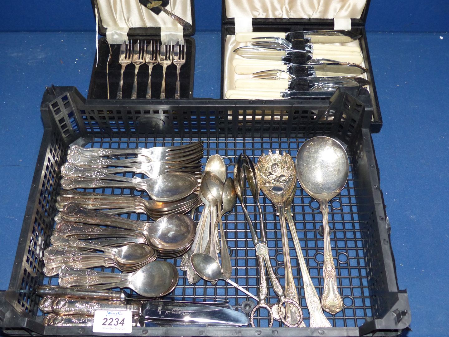 A quantity of silver plated cutlery for six, boxed cake forks and fish knives.