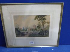 A framed and mounted Watercolour depicting a village Church with a figure sitting,