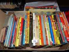 A box of children's books including Yogi Bear annuals, The Flintstones,