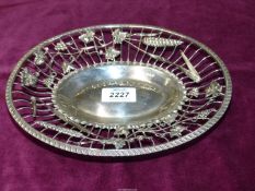 A Silver open work oval Dish decorated with ears of wheat, grapes and vines,