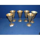 Six brass goblets with twisted stem.