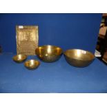Four Chinese brass bowls, two measuring 9 1/2" diameter and the other two 4 1/2" diameter,