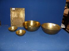 Four Chinese brass bowls, two measuring 9 1/2" diameter and the other two 4 1/2" diameter,