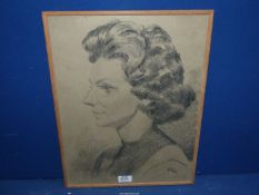 A charcoal Portrait of a woman in profile by Roy, 1954, 14 1/2'' x 18 1/2''.